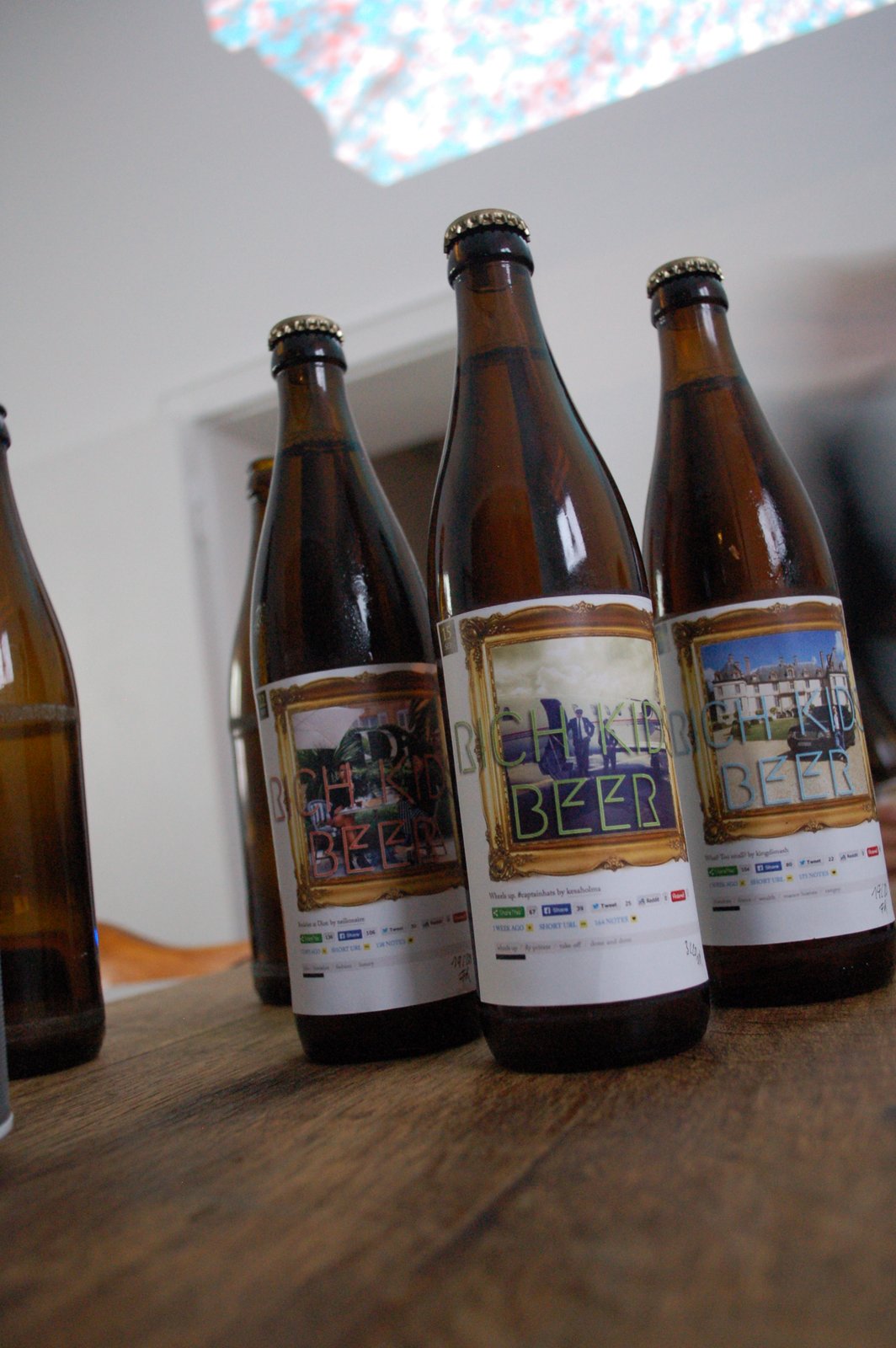 Three amber bottles standing in a row, labels facing out