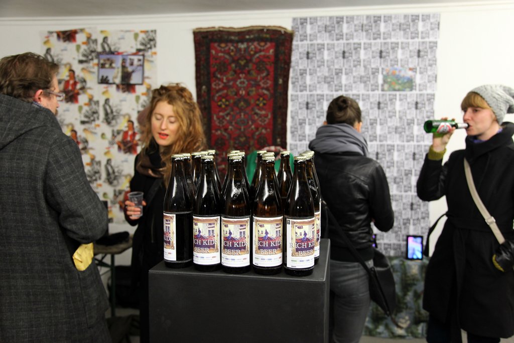 The LSDSL show, 2013 — bottles on a plinth before a wall of internet images